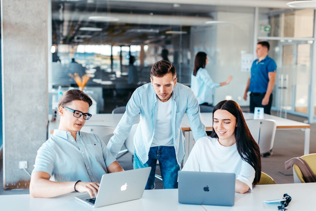 business team discussing code